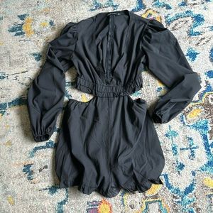 Black cut out long sleeve romper.